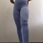 Woman modeling active-wear brand Sweat or Sparkle Athletics Carolina Blue Scrunch Leggings.