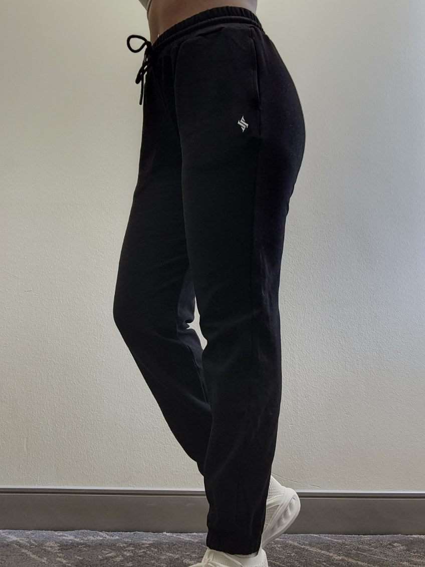 Woman modeling active-wear brand Sweat or Sparkle Athletics Black Sweatpants.